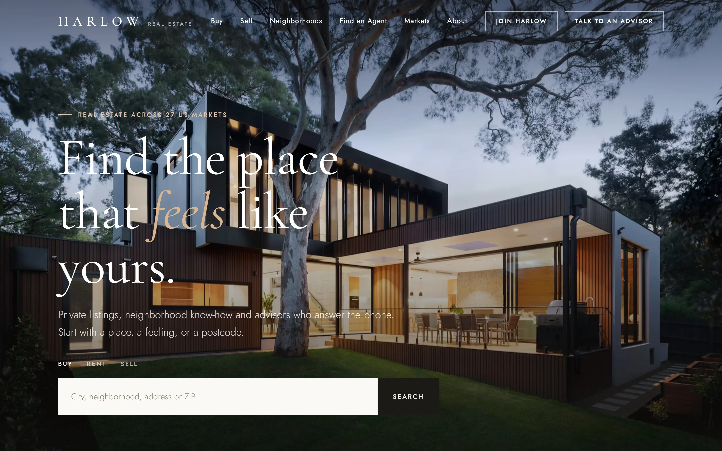 Luxury real estate website hero with animated headline and property search